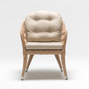 Resin wicker armchair with beige Olefin cushion, handwoven in rattan style on white background – Trendgoat outdoor collection