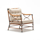 Bamboo-inspired rattan-style resin wicker armchair with Olefin cushion in beige on white background – part of Trendgoat Berrie Bamboo set