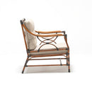 Bamboo-inspired rattan-style resin wicker armchair with Olefin cushion in beige on white background – part of Trendgoat Berrie Bamboo set