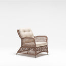 High-back outdoor armchair with handwoven rattan-effect resin wicker and Olefin fabric cushions from Trendgoat Daffodil range