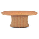 Trendgoat Gardenia rattan table featuring handwoven resin wicker design over a rust-resistant aluminum frame, topped with a toughened glass surface; available in 110×220 cm and 90×180 cm sizes for use as a dining or coffee table in garden and conservatory settings.