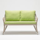 Trendgoat Iris 2-seater outdoor sofa featuring compact form, handwoven rattan detail, and UV-resistant Olefin cushions