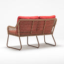 Trendgoat Jasmine compact 2-seater garden sofa with handwoven wicker, aluminum frame, and weather-resistant cushions.