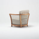 Spacious wooden garden armchair with handwoven rattan detailing and deep foam-filled chesterfield cushion, part of Lavender Lounging Collection by Trendgoat back view