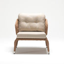 Single rattan armchair with high backrest, handwoven detailing, and weather-resistant cushion from Lilly garden set by Trendgoat