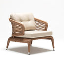 Single rattan armchair with high backrest, handwoven detailing, and weather-resistant cushion from Lilly garden set by Trendgoat