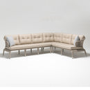 Handwoven synthetic rattan corner sofa section with plush Olefin cushions, part of Lilly 7-seater outdoor set