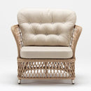 Curved-back armchair in traditional handwoven resin wicker with weather-resistant cushion – Novara garden set