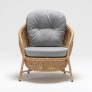 High-back resin wicker armchair with weatherproof cushion – elegant garden lounge seating from TrendGoat
