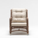 High-back armchair in resin wicker with weatherproof cushion – part of Palm garden set by TrendGoat